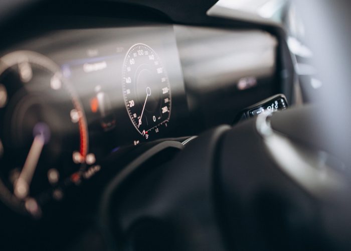 Car dashboard and wheel close up